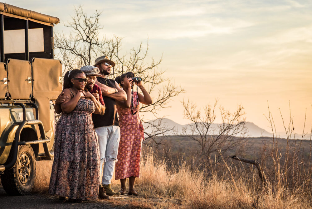 Marakele_Gamedrive_Models chatting in the sunset_Rudolph de Girardier