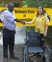 KNP Managing Executive, Abe Sibiya receiving one the wheelchairs from Keren Austen of the Rotaract Club, Germiston
