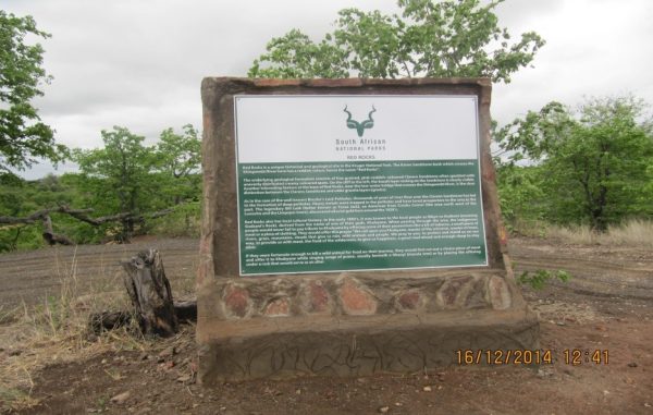 An interpretative board at Red Rocks